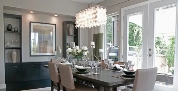 Elegant dining room chandelier installation above table in Sacramento, CA