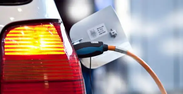 Electric car plugged into EV charger after professional installation in Sacramento, CA