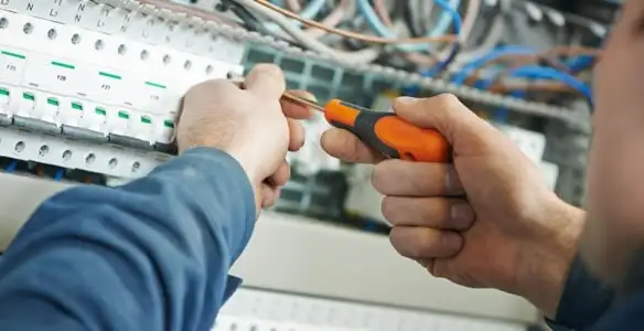 electrical service showing licensed electrician performing electrical panel maintenance and adjustments in Sacramento, CA