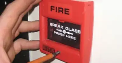 fire alarm installation service showing manual fire alarm pull station installed by licensed electricians in Sacramento, CA