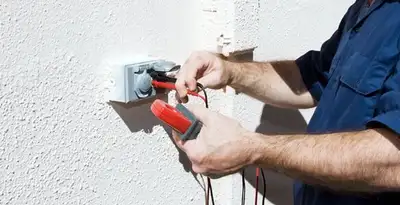 Electrician performing home electrical outlet and wiring inspection in Sacramento, CA