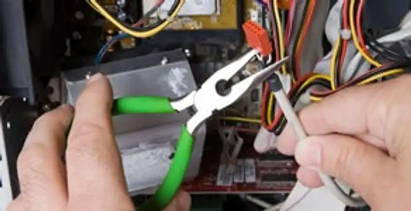 Licensed electrical contractor performing electrical repair with tools in Antelope, CA