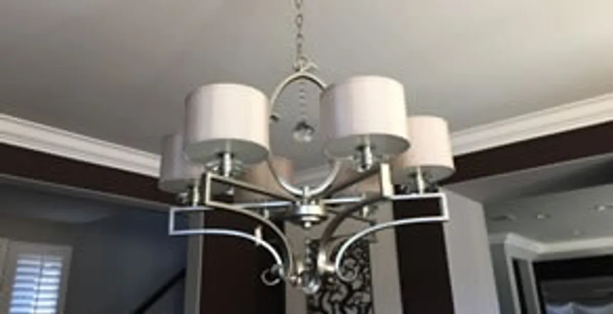 Modern chandelier installation with multiple light fixtures in Sacramento, CA