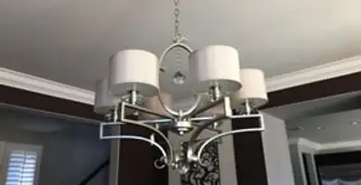 Modern chandelier installation with multiple light fixtures in Sacramento, CA