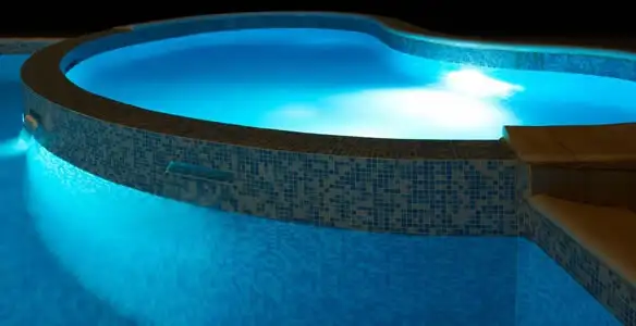 pool light installation and repair services highlighting illuminated pool interior lighting in Sacramento, CA