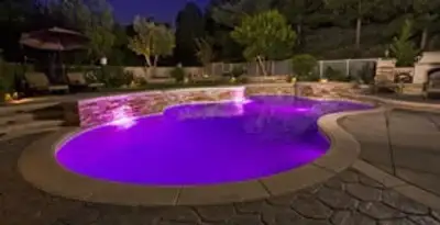 pool light installation and repair services illuminating a residential swimming pool in Sacramento, CA