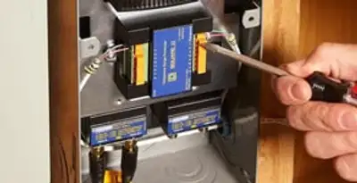 Whole home surge protection device being installed by a licensed electrician to protect electrical systems in Sacramento, CA